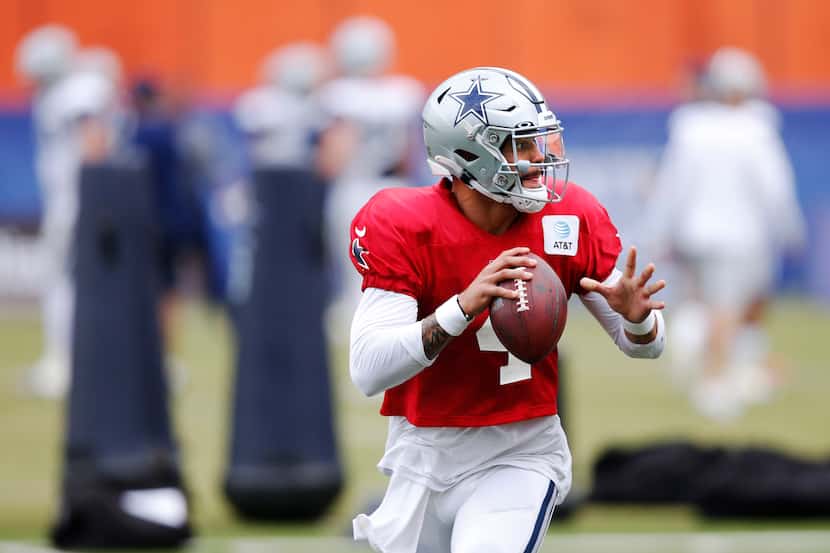 Dallas Cowboys quarterback Dak Prescott (4) runs through a drill in practice during training...