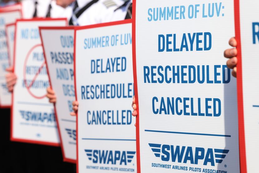 Southwest Airlines Pilots stand picketing for better work conditions, on Tuesday, June 21,...
