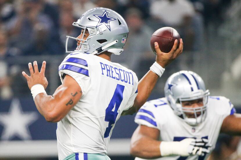 Dallas Cowboys quarterback Dak Prescott (4) makes a pass in the fourth quarter quarter of an...