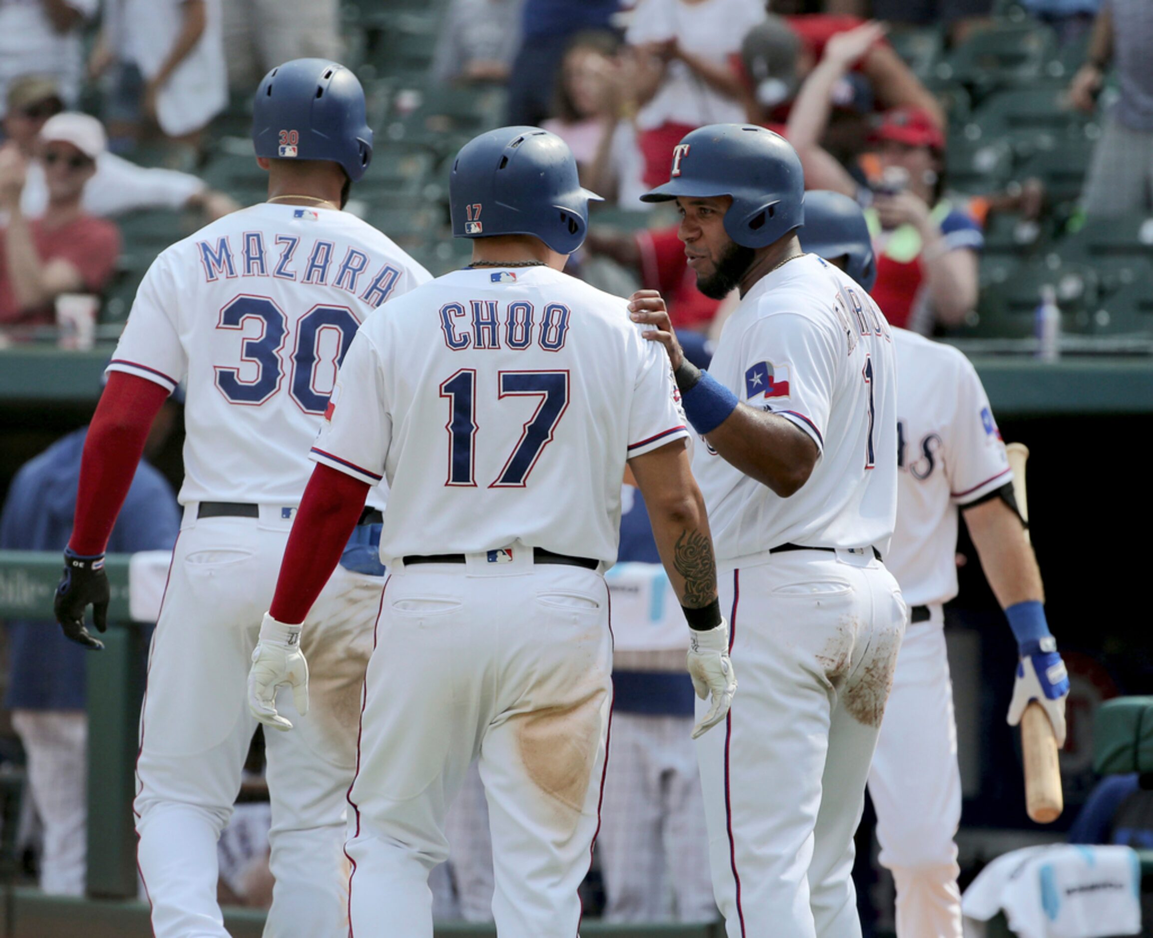 Texas Rangers Nomar Mazara (30), Shin-Soo Choo (17) and Elvis Andrus (1) celebrate after...