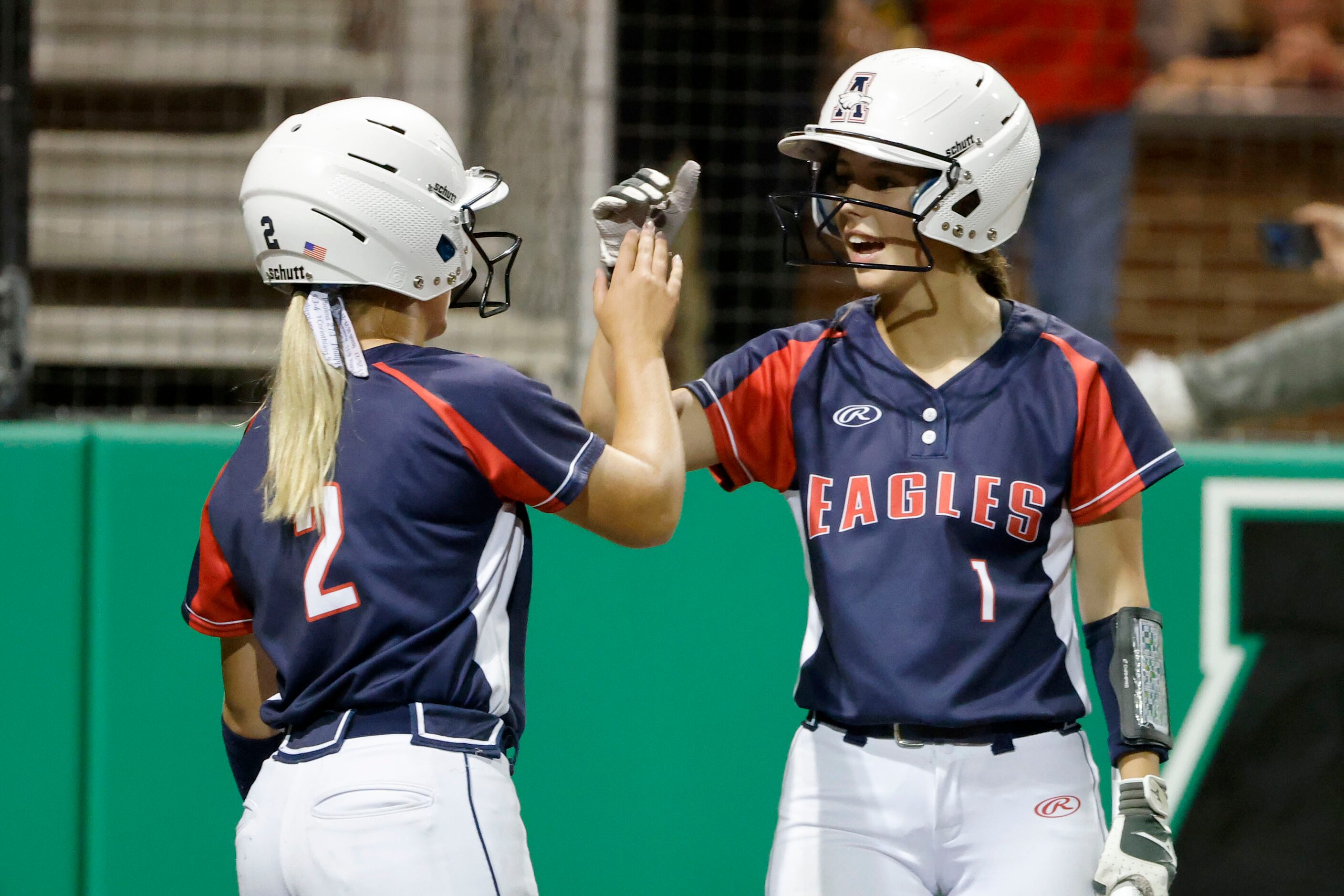 Allen’s Morgan Wright (2) gets congratulated by Harper Garrett (1) after Wright scored on a...