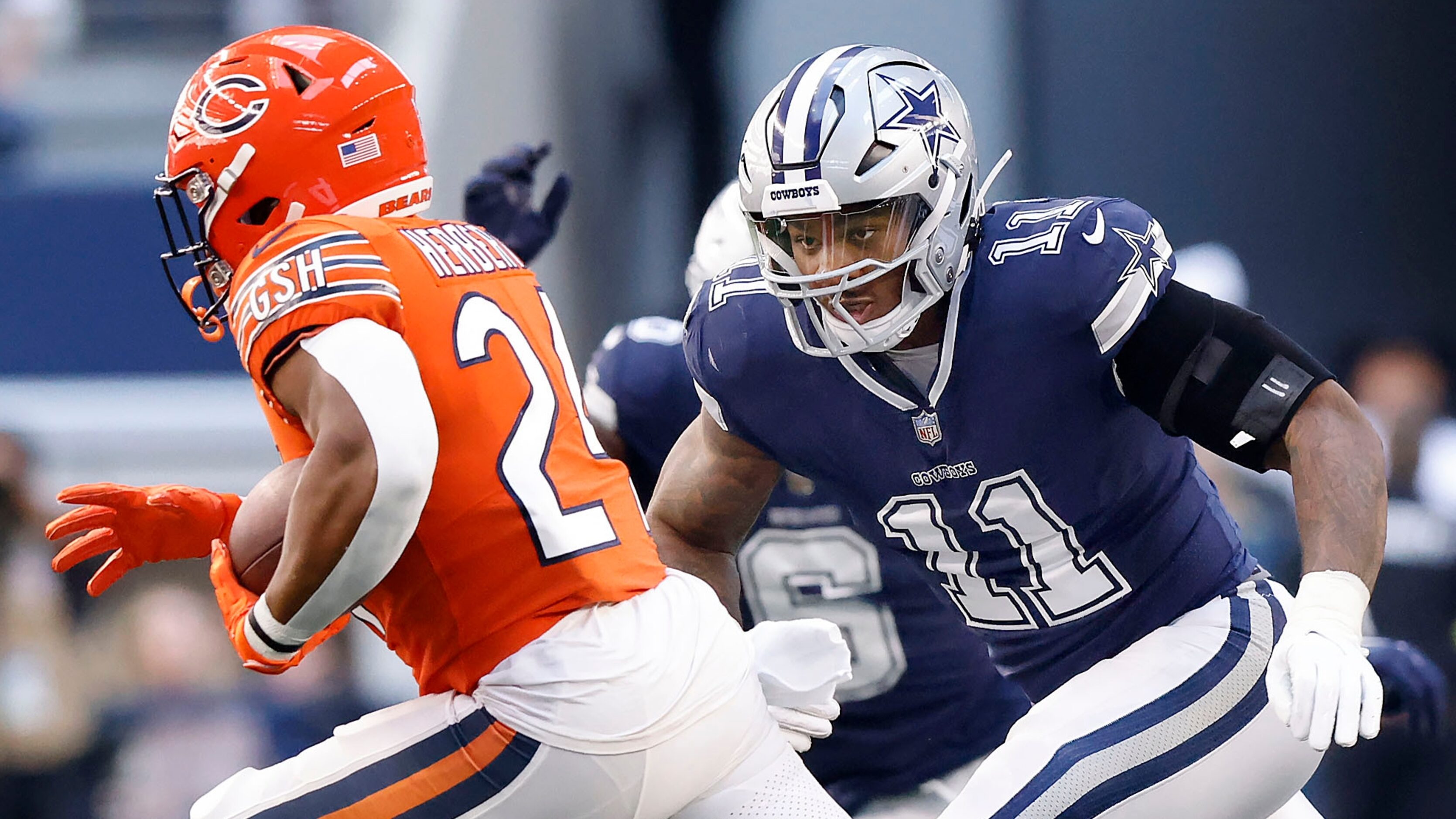 Dallas Cowboys linebacker Micah Parsons (11) gives chase to Chicago Bears running back...