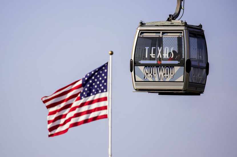 People rode the Texas Skyway during the Fair Park Fourth celebration in Fair Park on the...