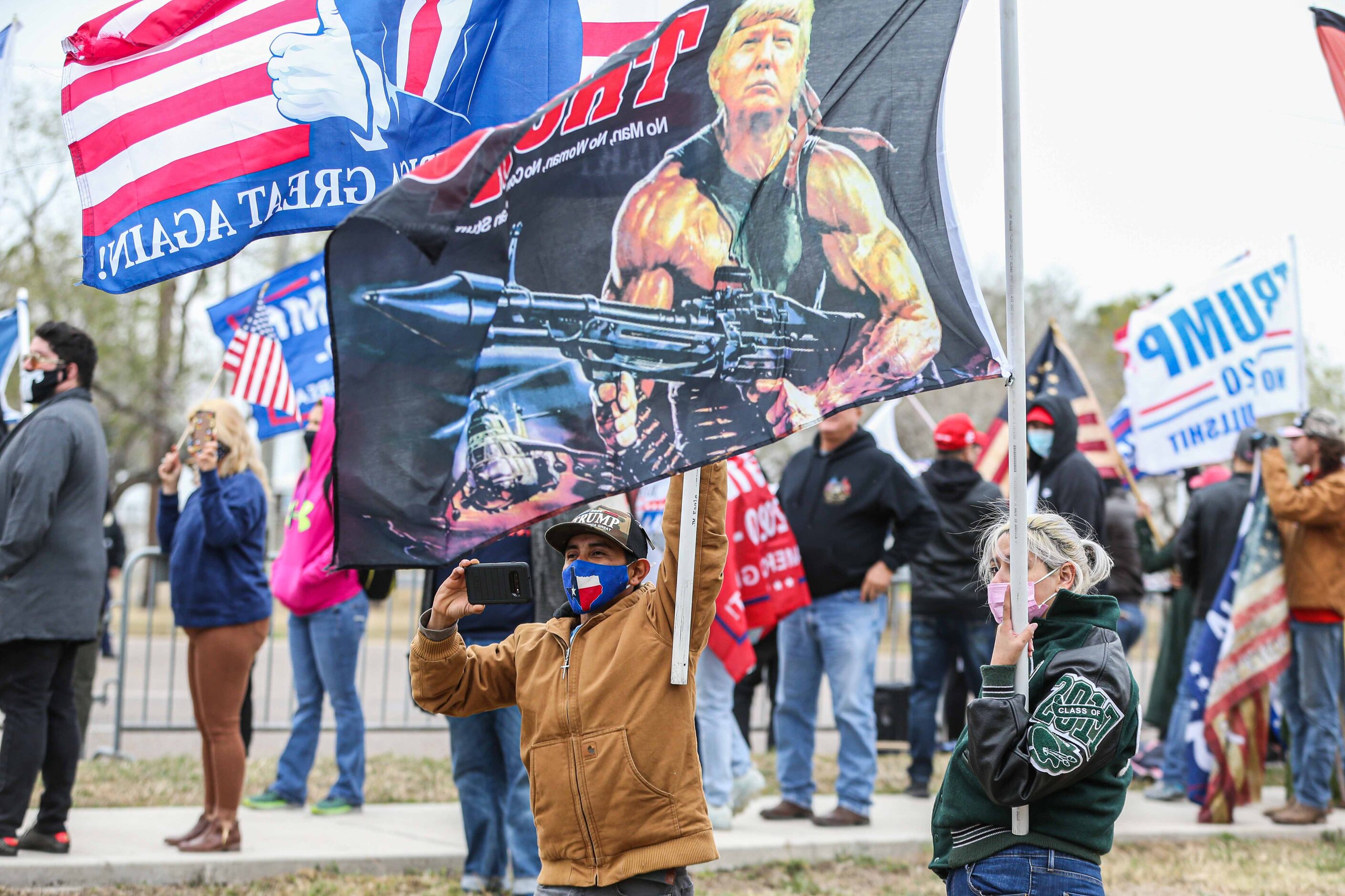 President Donald Trump supporters at S 10th St and Bales Rd during a rally as Trump is...