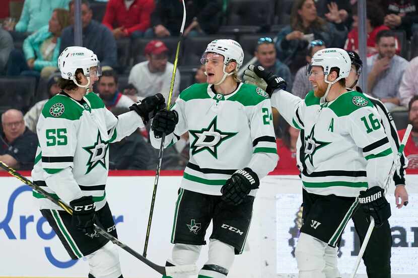 Dallas Stars center Roope Hintz, center, celebrates his goal with Thomas Harley (55) and Joe...