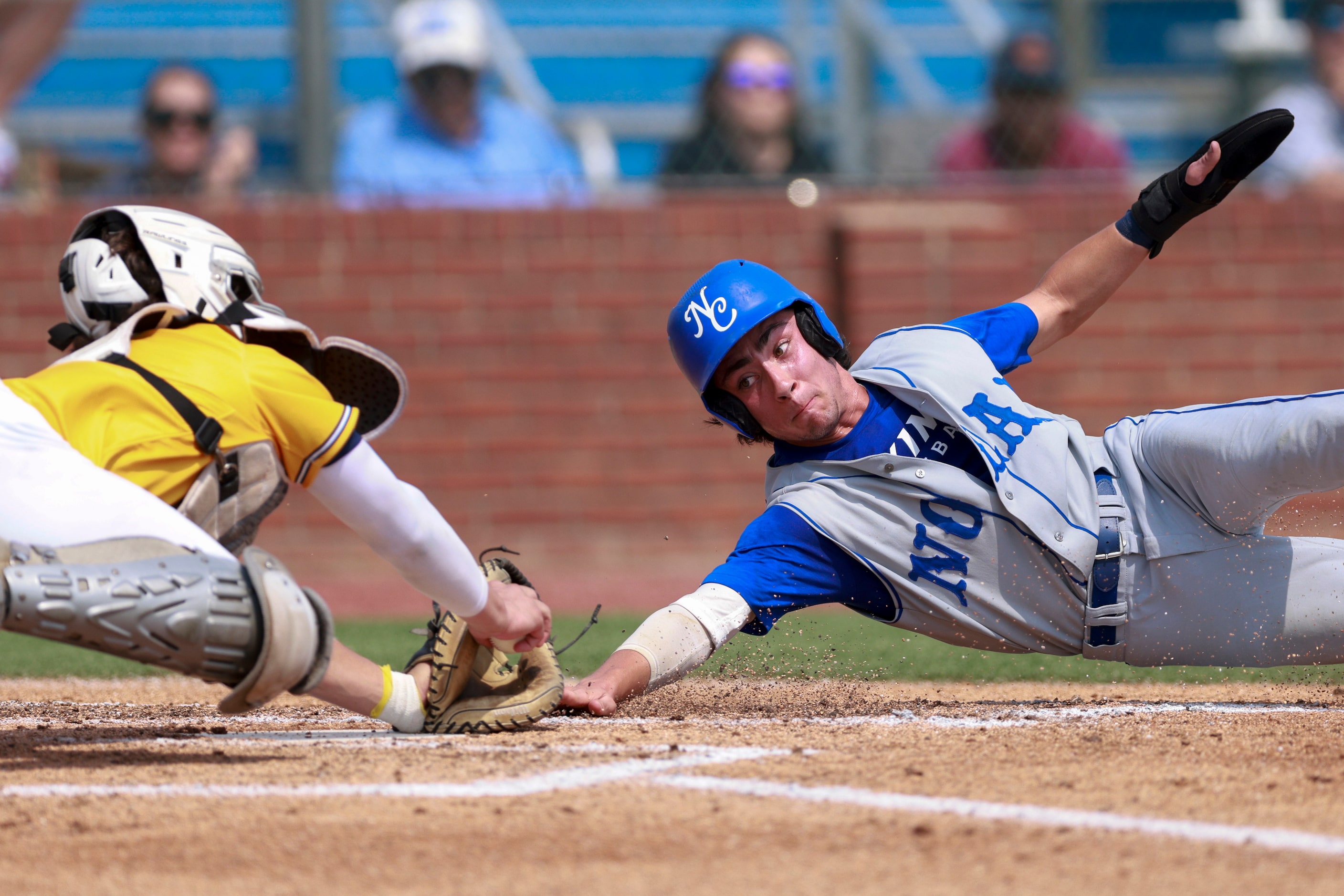 Plano Prestonwood catcher AJ DePaolo (5) tags Fort Worth Nolan infielder Robert Nagid (7) at...