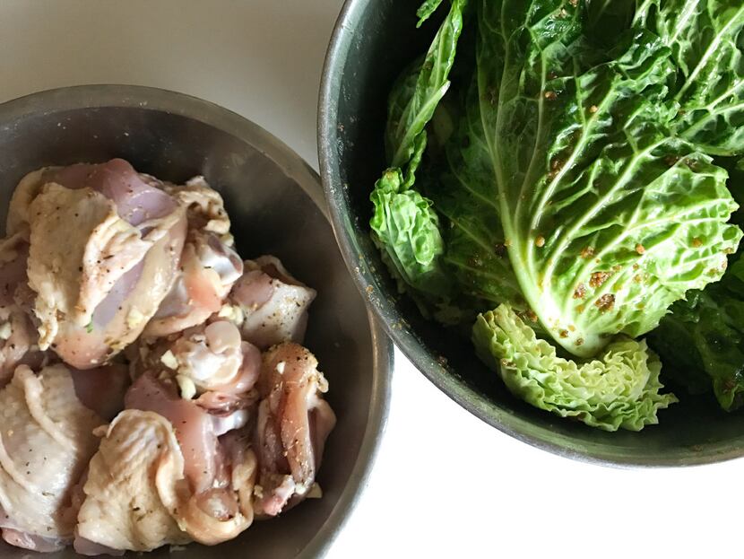Chicken thighs and Savoy cabbage -- ingredients for a one-pan roasted dinner.