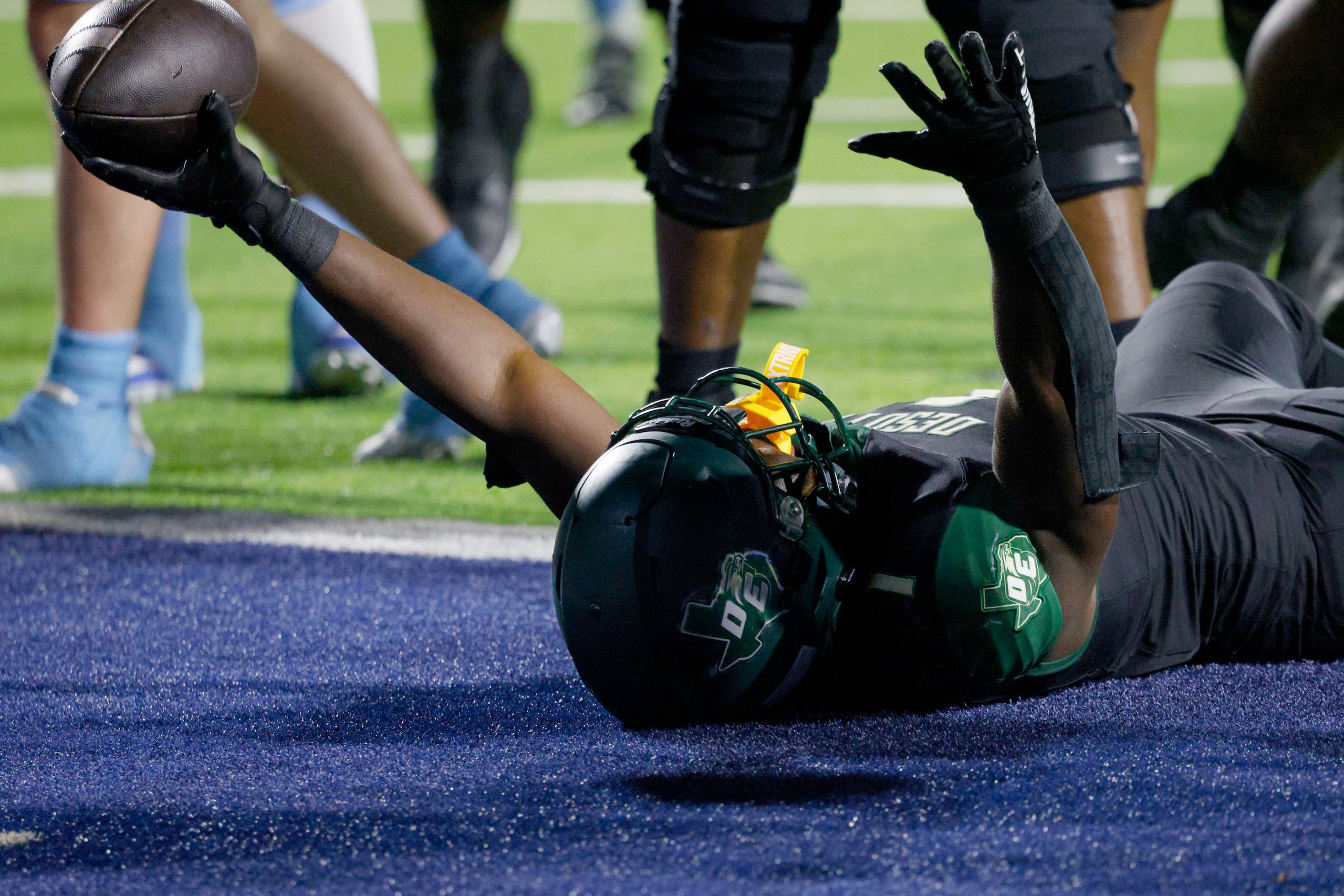 DeSoto's Deondrae Riden Jr. (1) reacts after scoring a touchdown against Wylie East in the...