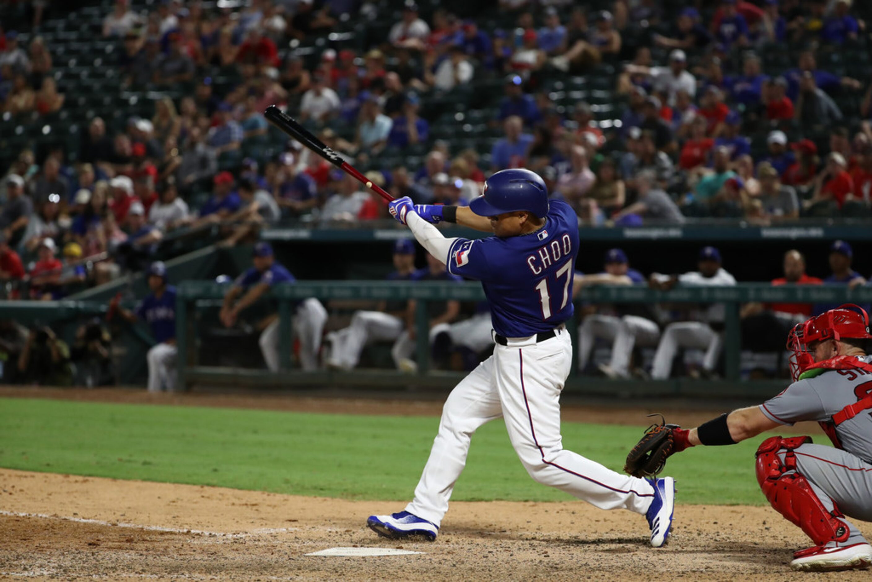 ARLINGTON, TEXAS - AUGUST 21:  Shin-Soo Choo #17 of the Texas Rangers hits a one run single...