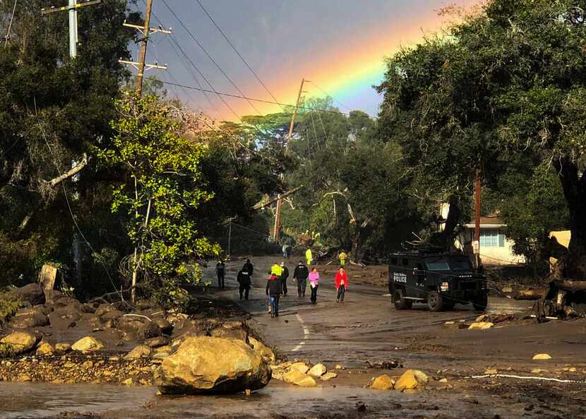 In this photo provided by Santa Barbara County Fire Department, shows a rainbow forming...