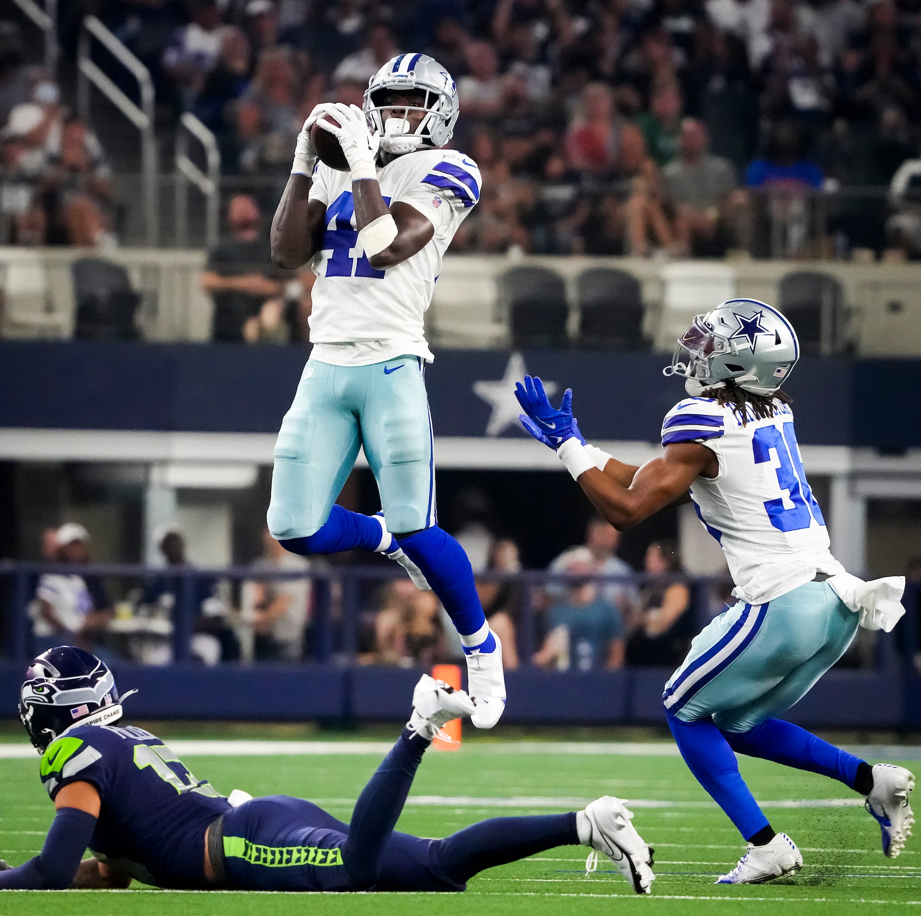 Dallas Cowboys safety Markquese Bell (41) intercepts a pass intended for Seattle Seahawks...