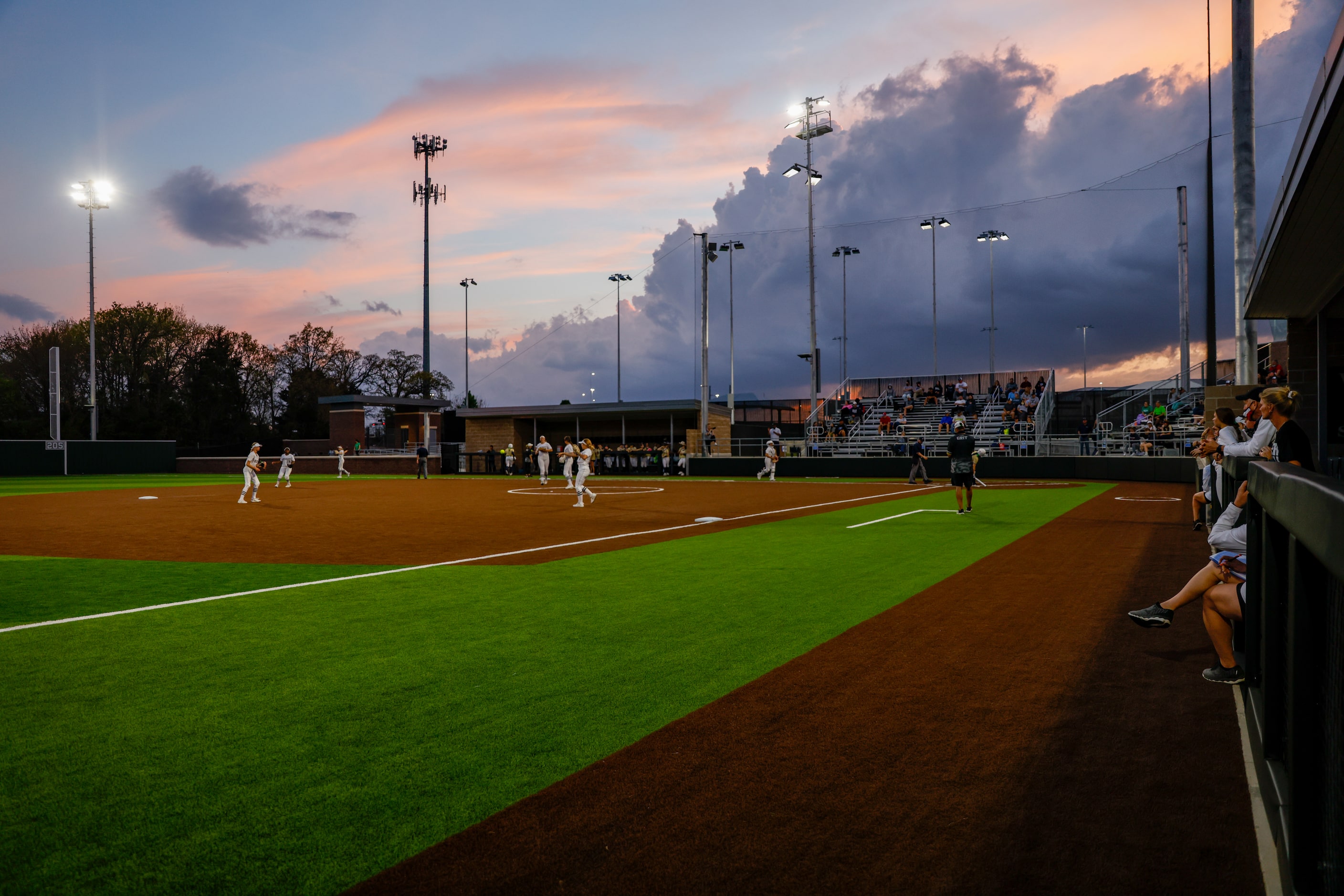 The sun sets during a nondistrict high school softball game between Denton Guyer and Keller...