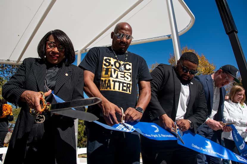 Cutting the ribbon to officially open the park Nov. 13 were City Council member Carolyn King...