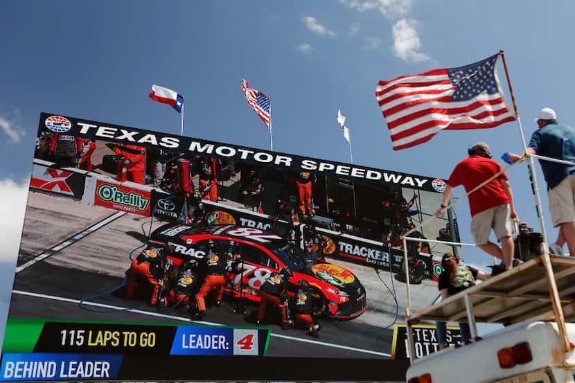 NASCAR fans watch "Big Hoss TV" during the O'Reilly Auto Parts 500 at Texas Motor Speedway...
