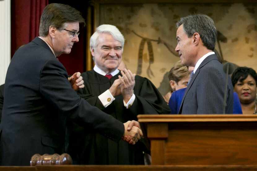 Texas Supreme Court Chief Justice Nathan Hecht, center, at the swearing-in Joe Straus,...