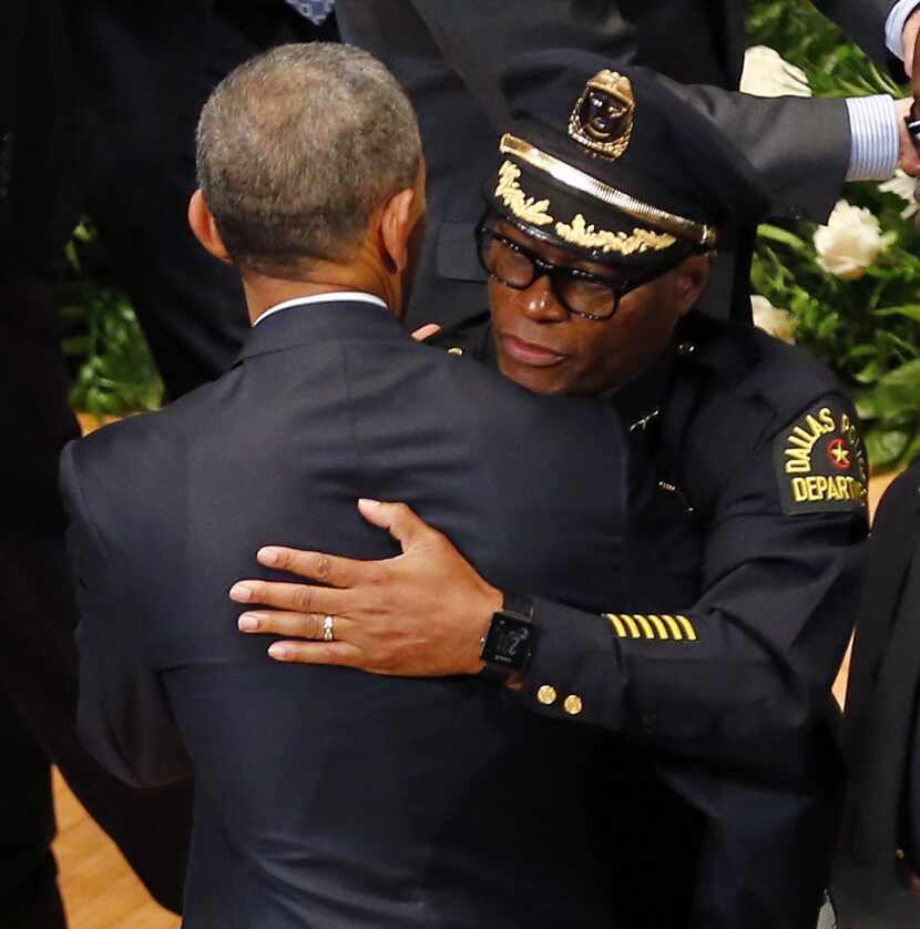 The president and Dallas Police Chief David Brown exchange hugs at Tuesday's memorial.