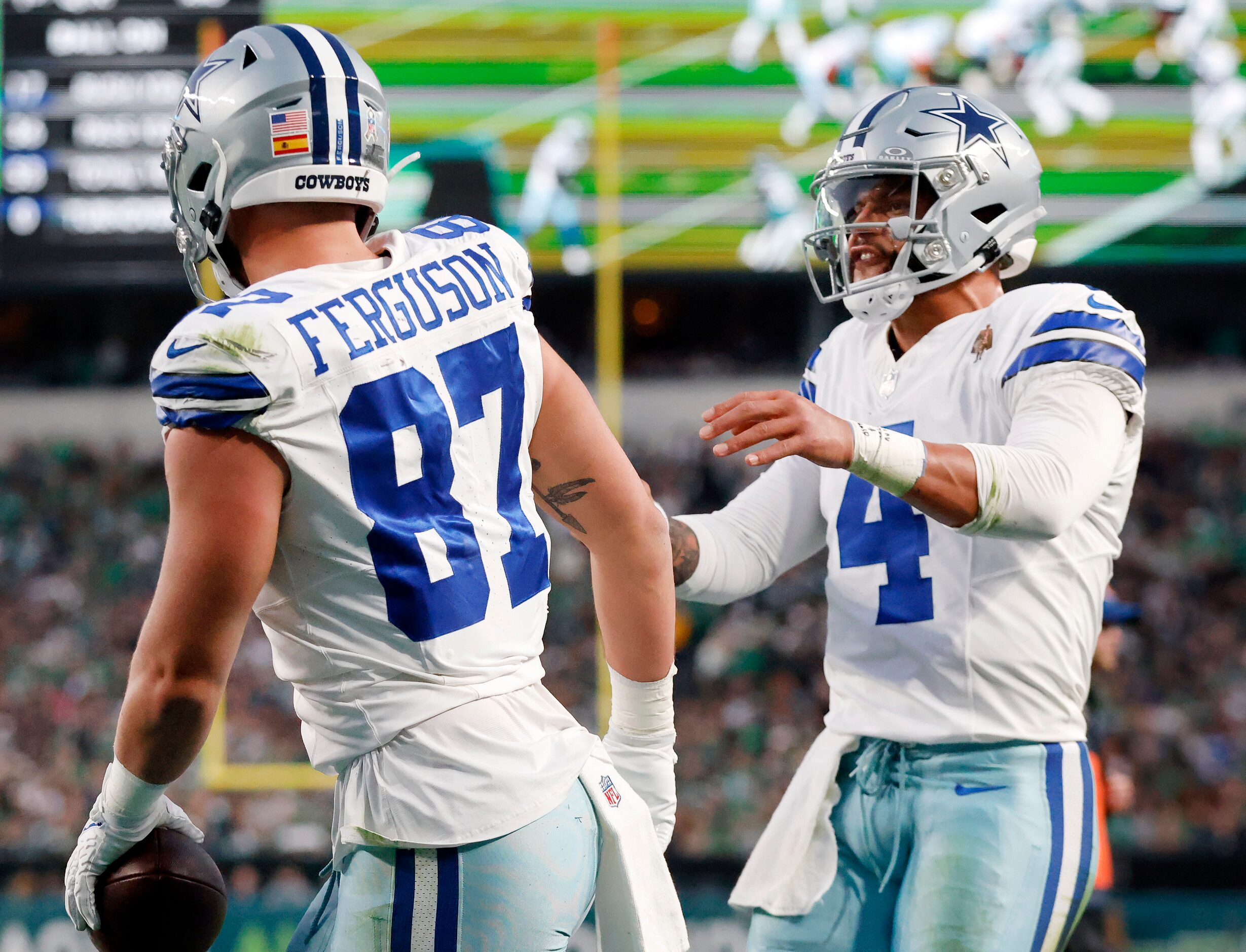 Dallas Cowboys quarterback Dak Prescott (4) congratulates Dallas Cowboys tight end Jake...