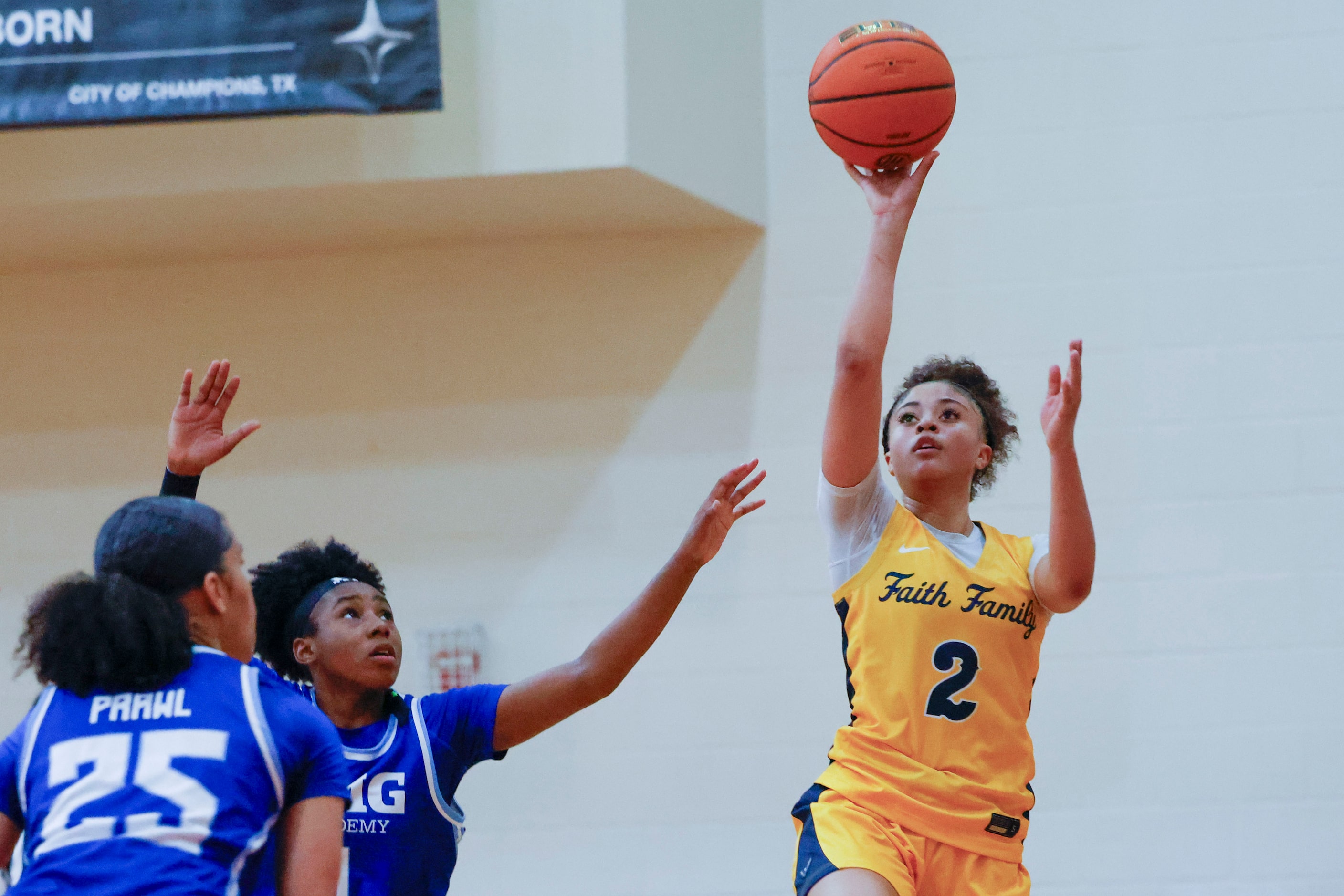 Oak Cliff Faith Family Academy’s Gianna Jordan (2) shoots the ball as IMG Academy Kelis...