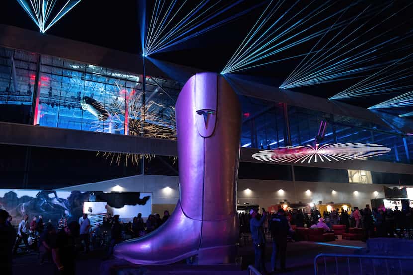 A giant cowboy boot was among the attractions when Tesla held a grand opening "Cyber Rodeo"...