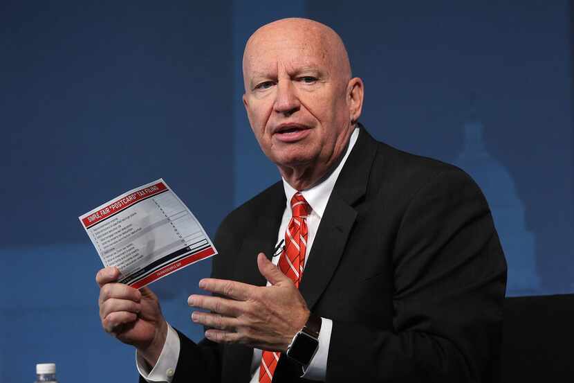 Kevin Brady, R-The Woodlands, chairman of House Ways and Means Committee, holds up a...