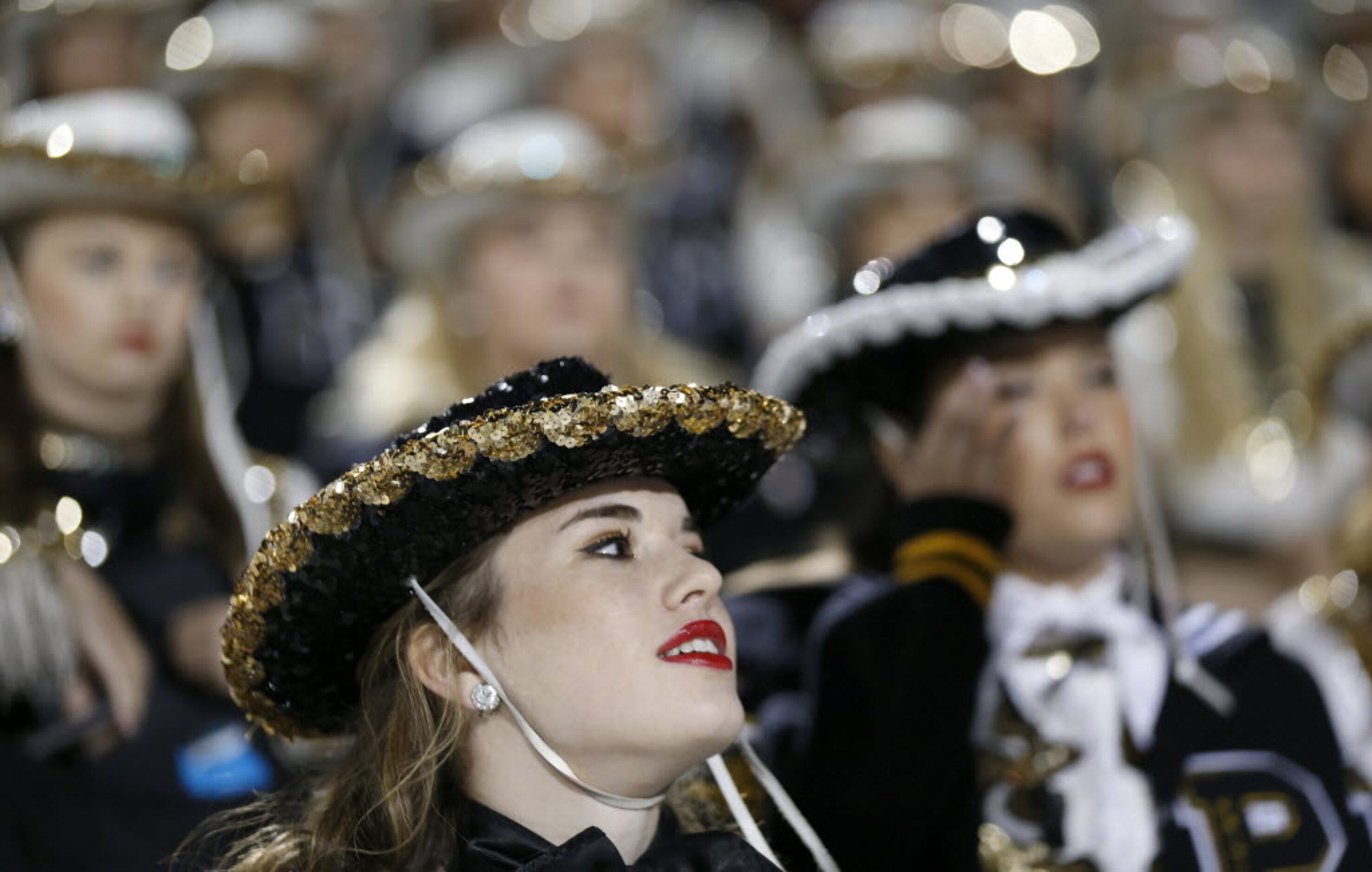 Kendall Brunworth, 17, member of the Plano East's Gold Girls, sits in the stand prior to the...