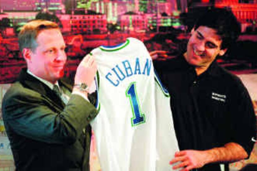  Ross Perot Jr. presented new owner Mark Cuban with a Mavericks jersey in January 2000 at a...