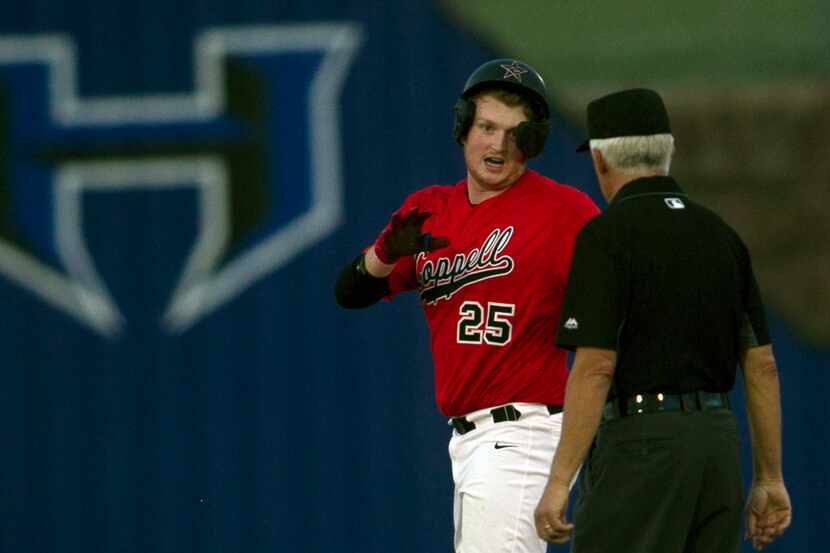 Coppell pitcher Chayton Krauss (25) asks for time-out as he is relieved by a pinch runner...