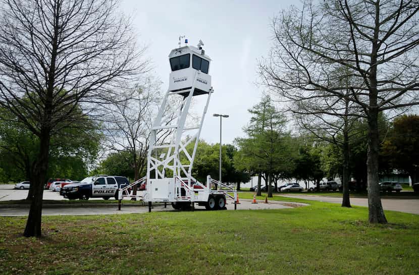 A mobile police tower and vehicle are positioned near the main entrance of Prestige...