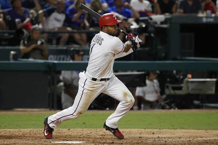ARLINGTON, TX - SEPTEMBER 8: Elvis Andrus #1 of the Texas Rangers singles and drives in two...
