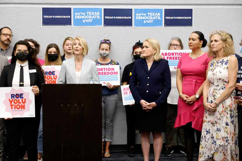 Former Texas state senator Wendy Davis (at podium) joined other Texas Democratic officials...