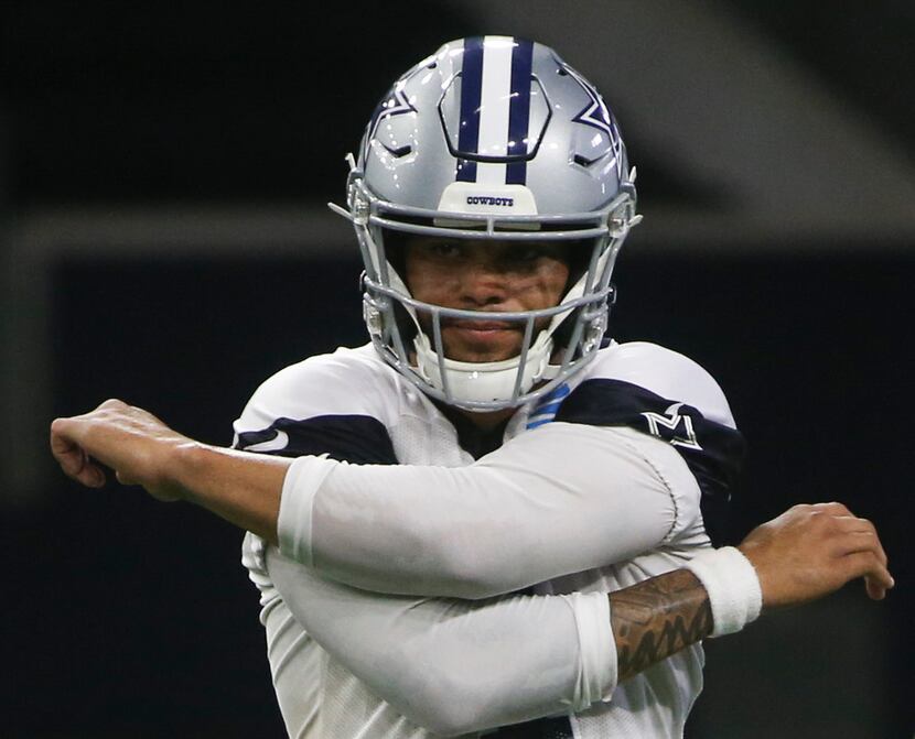 Dallas Cowboys quarterback Dak Prescott (4) participates in a drill during a Cowboys...