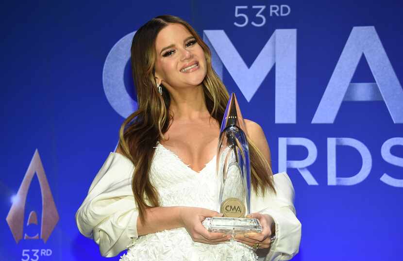 Singer-songwriter Maren Morris poses in the press room with the album of the year award at...