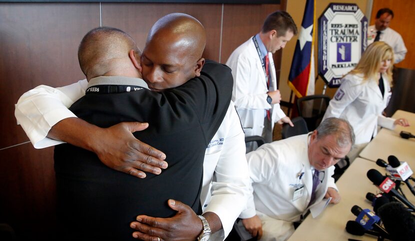 Dr. Alexander Eastman, medical director/chief of Rees-Jones Trauma Center (left) and Dr....