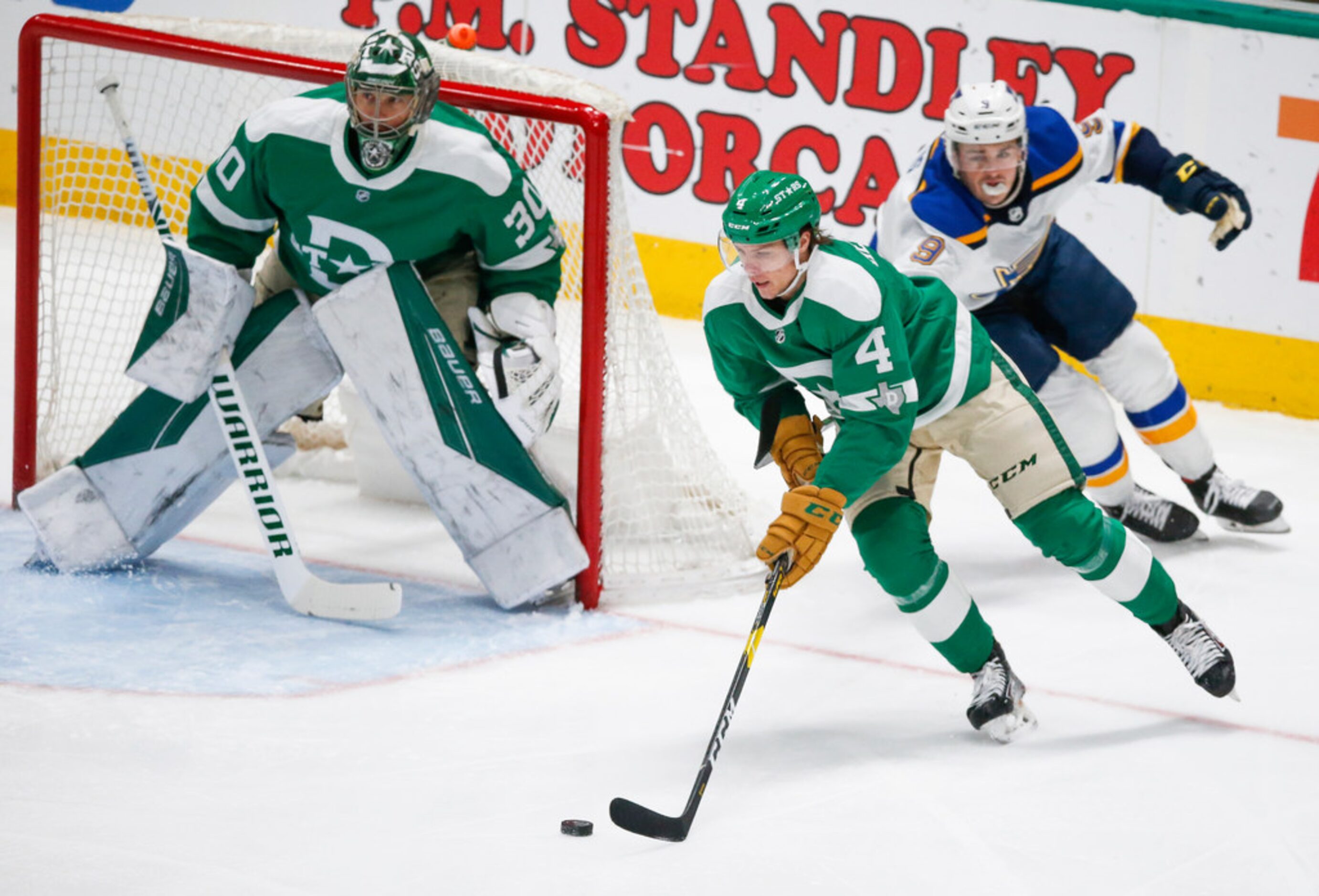 Dallas Stars defenseman Miro Heiskanen (4) makes a break down the ice past St. Louis Blues...