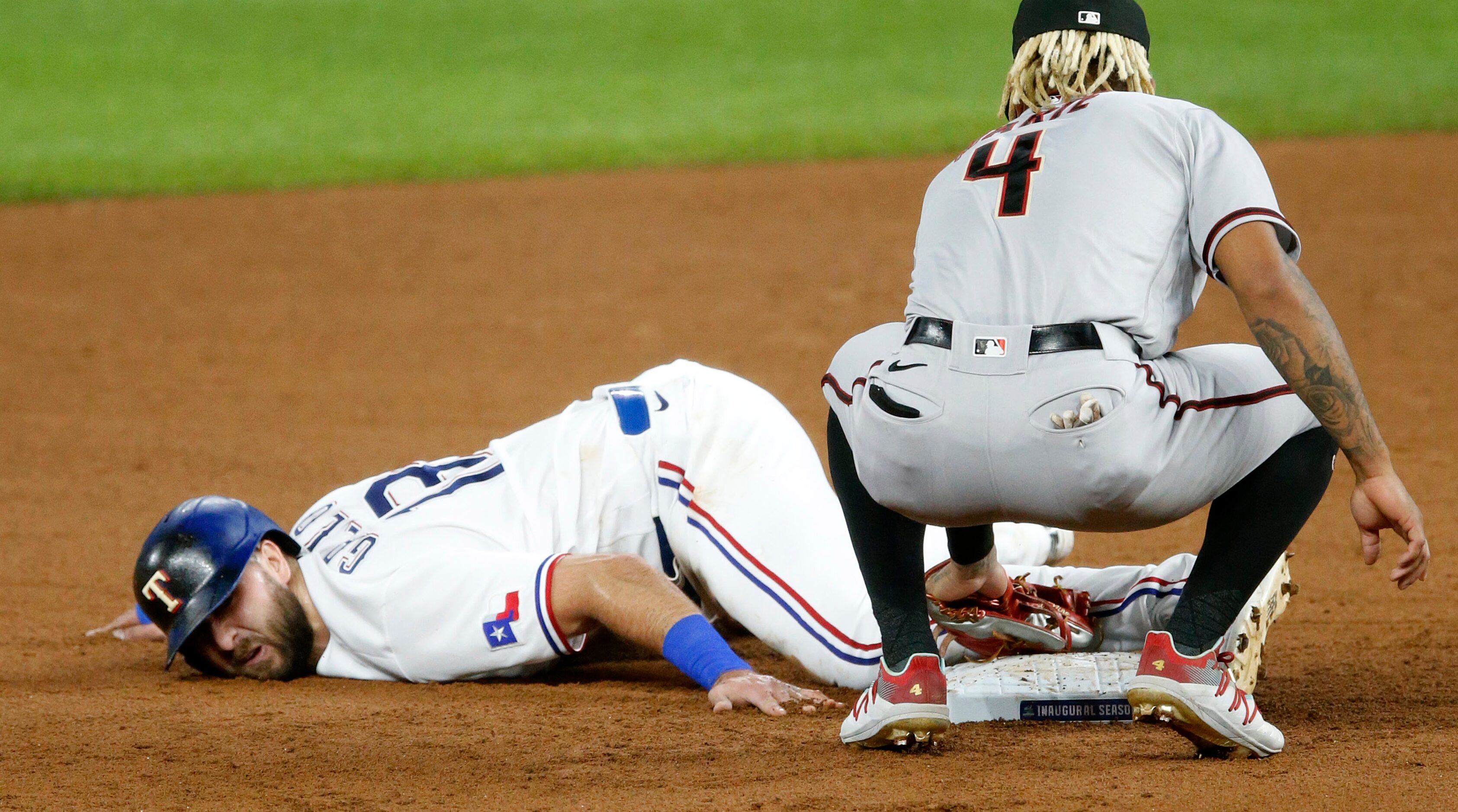 Texas Rangers right fielder Joey Gallo (13) steals second base as Arizona Diamondbacks...