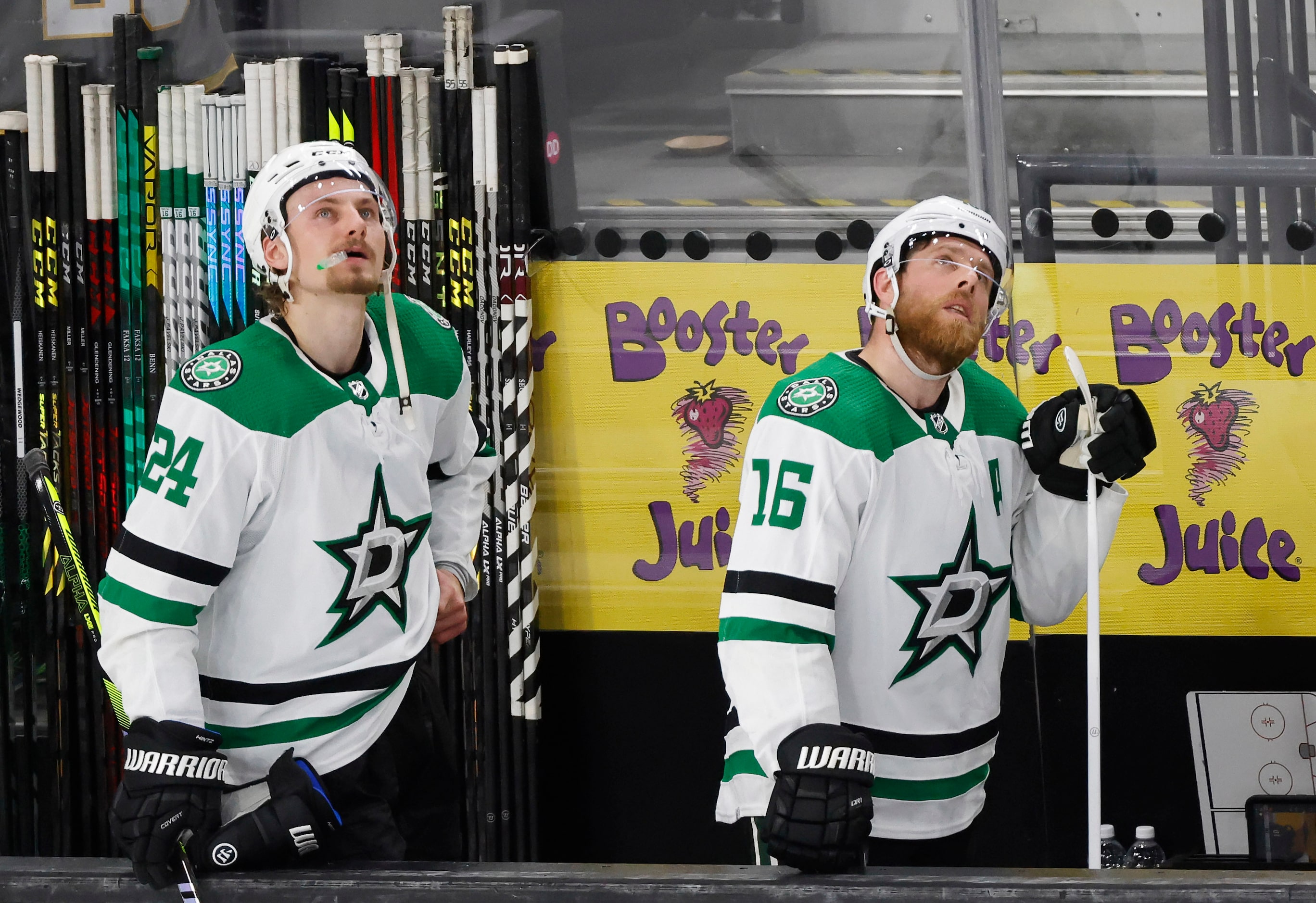 Dallas Stars center Roope Hintz (24) and center Joe Pavelski (16) watch the replay after...