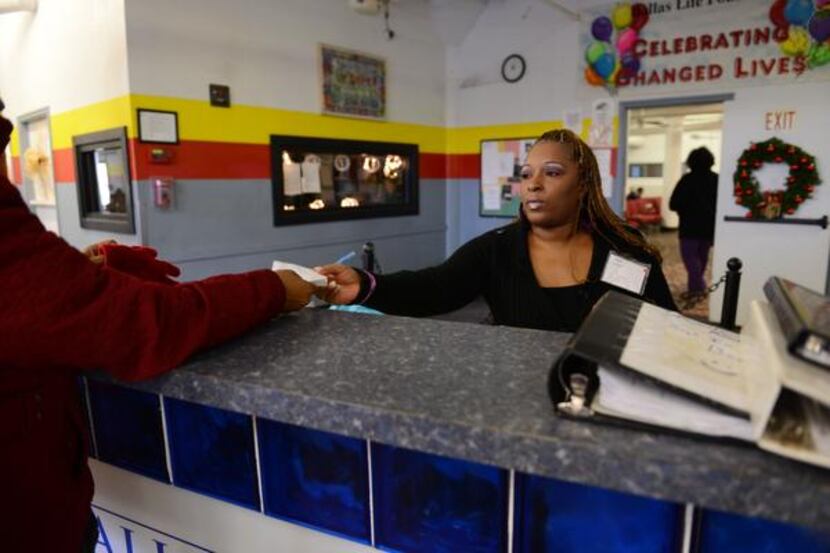 
Selita Griffin, 43, a resident staff member at Dallas LIFE Foundation, works at the...