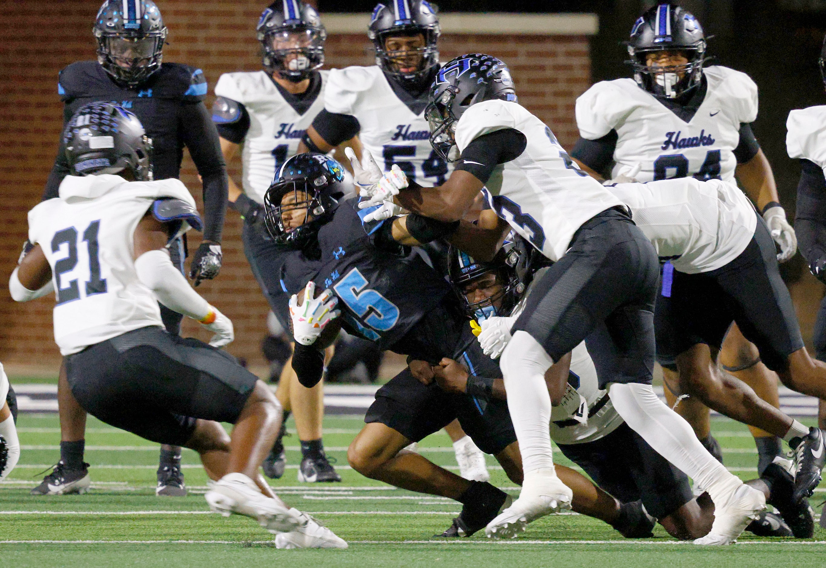 Rock Hill's Dominic Saidu (15) carries the ball against Hebron’s defense players in the...