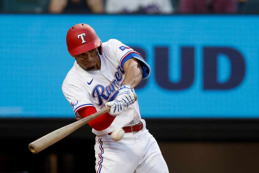 Texas Rangers center fielder Bubba Thompson (65) grounds into a double play during the third...
