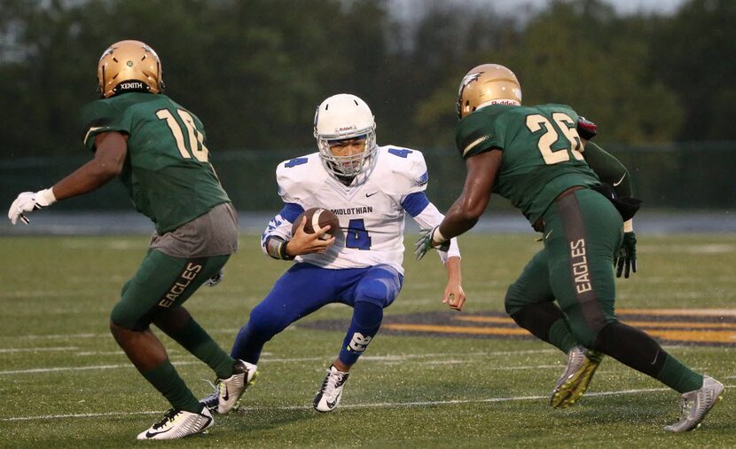 Midlothian quarterback Jerreth Sterns (4) is unable to gain the first down on a fourth down...