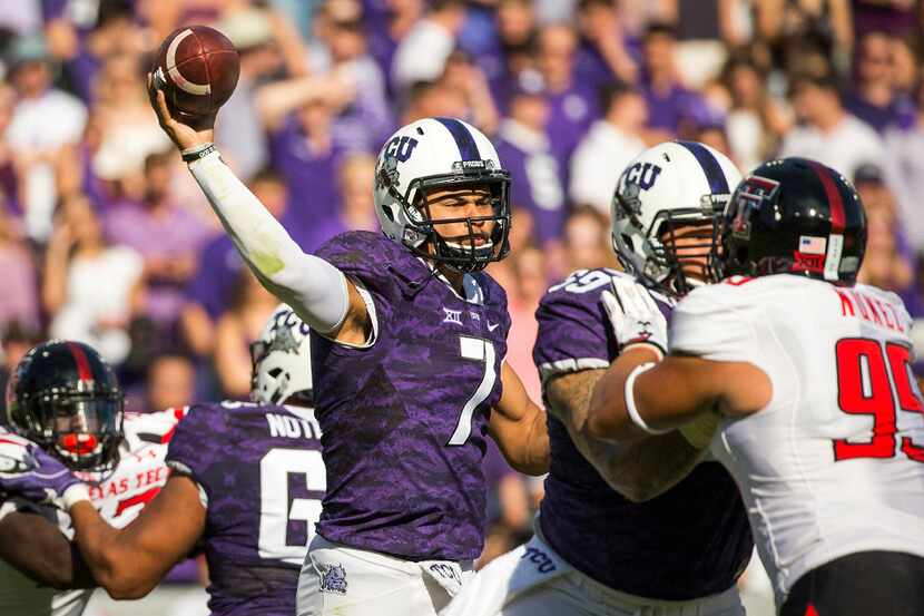 TCU quarterback Kenny Hill (7) throws a pass under pressure from Texas Tech defensive...