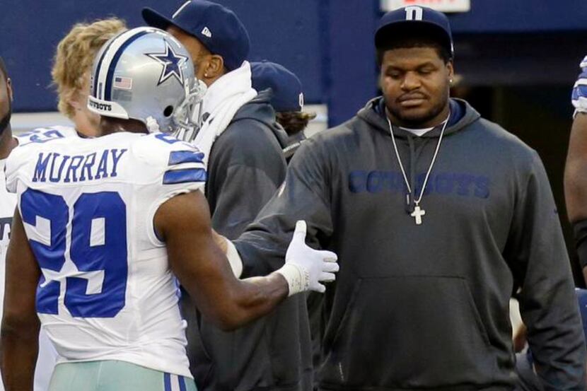 
Josh Brent visited his Dallas Cowboys teammates on the sideline during their game against...