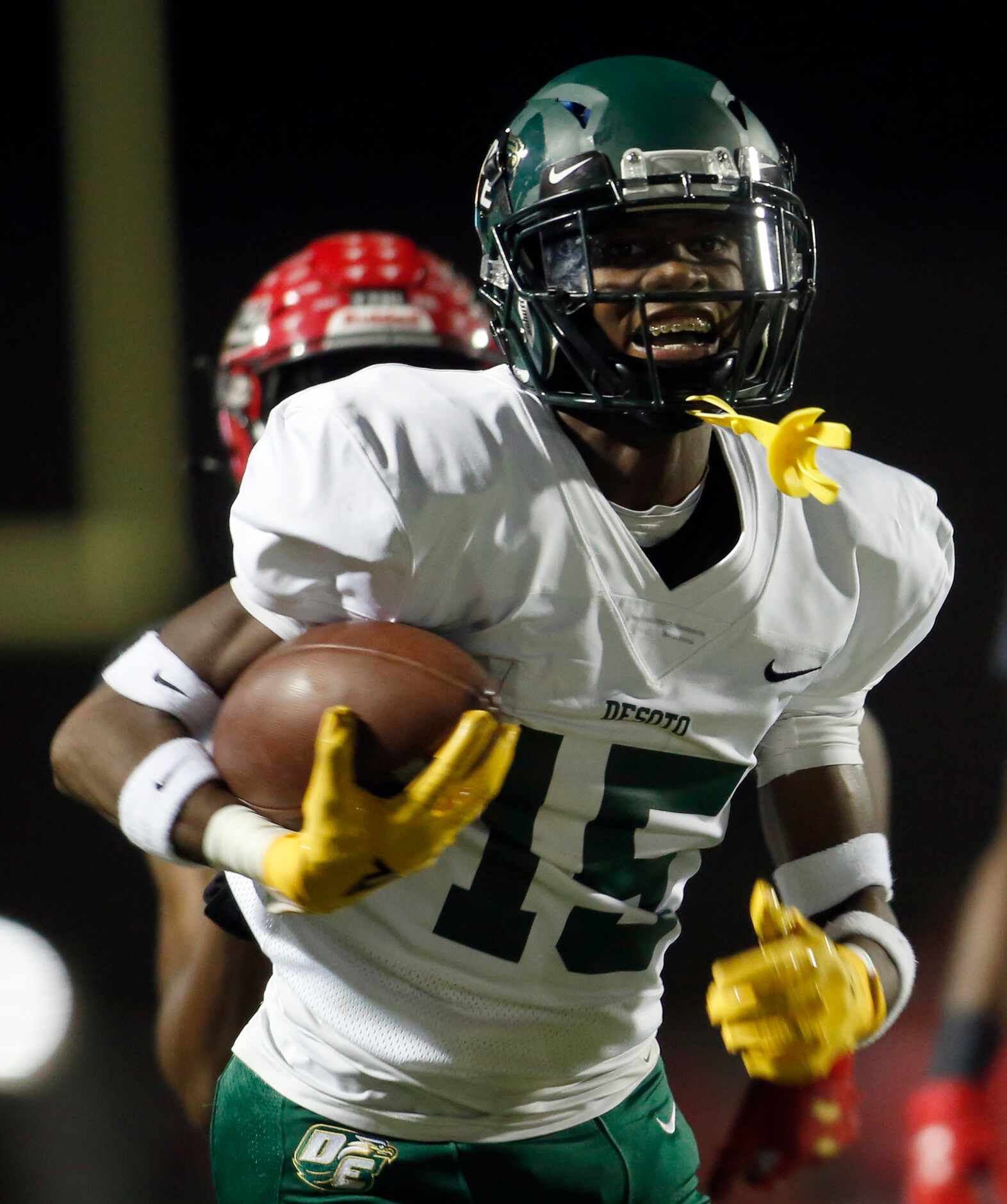 DeSoto defensive back Ashton Levells-Mitchell (15) sprints to the end zone for a touchdown...