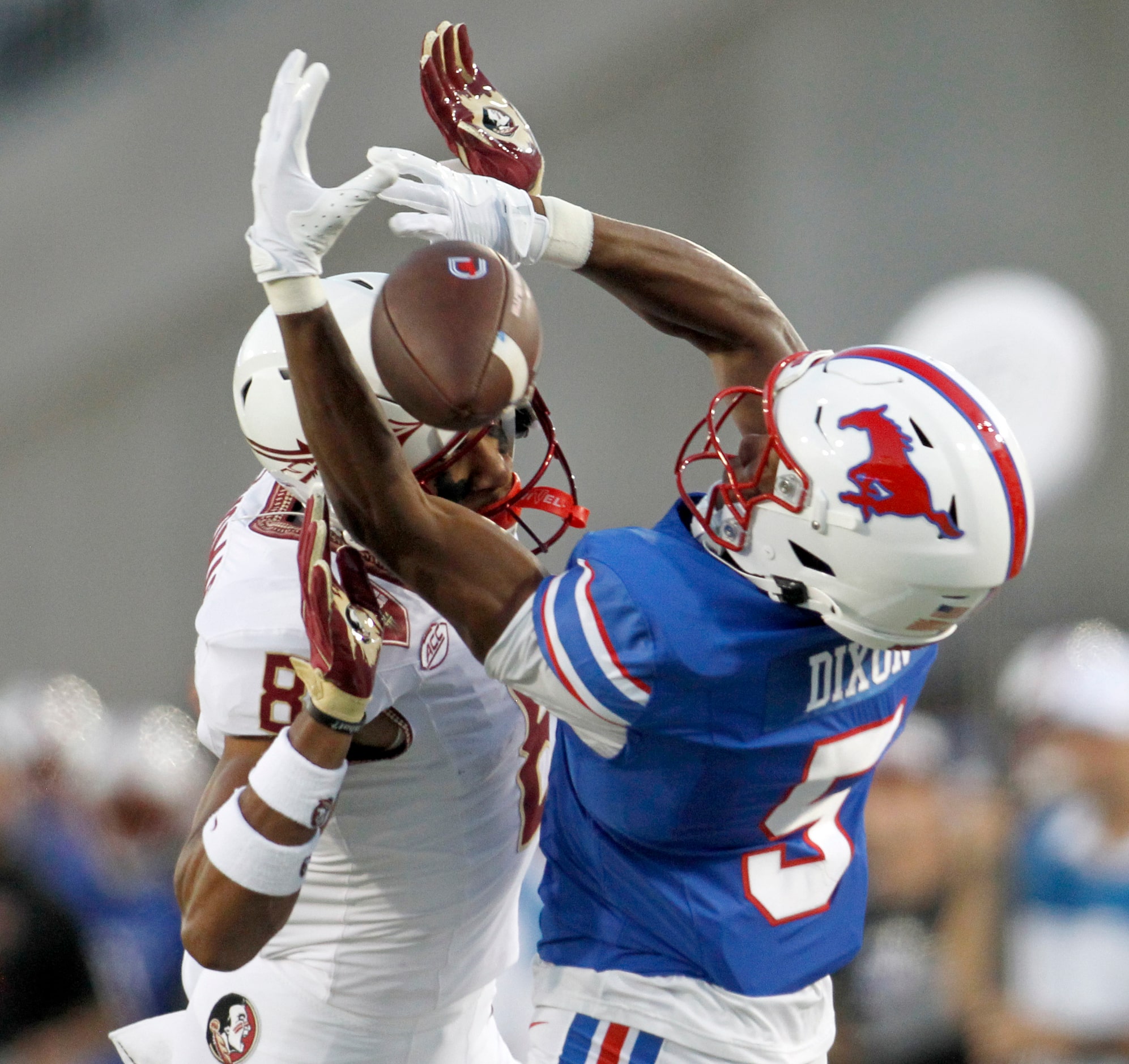 Southern Methodist University receiver Moochie Dixon (5), right, is unable to make the...