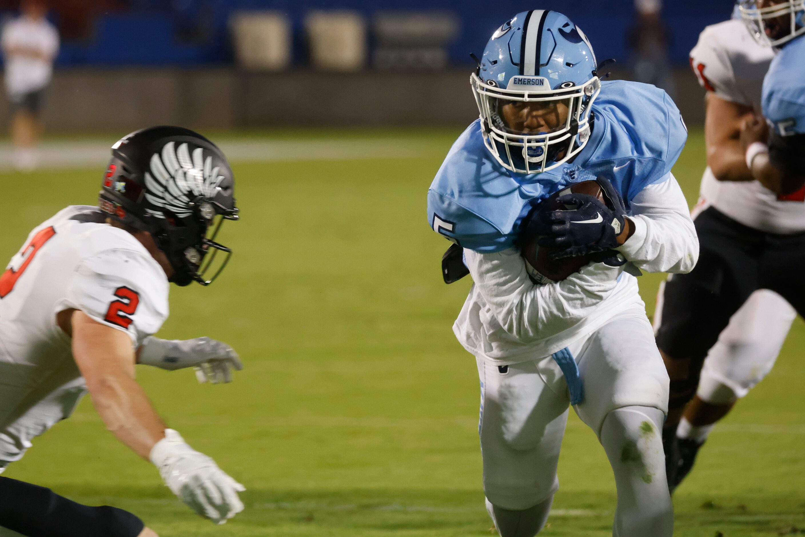 Emerson’s Bills Ishaqq (5) right, runs for a touchdown past Argyle’s Argyle’s Dax Horany (2)...