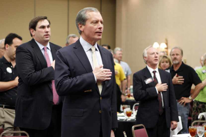 David Dewhurst recites the Pledge of Allegiance with the Plano Rotary Club.