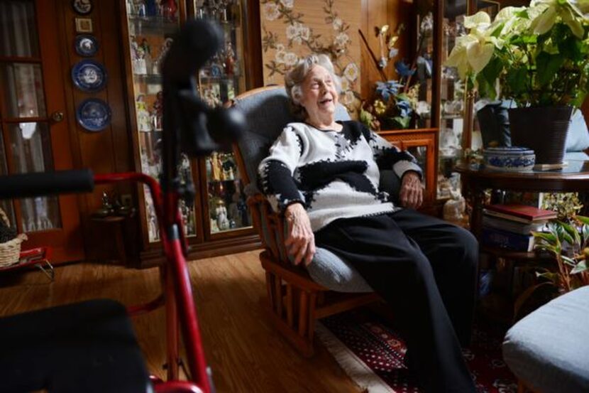 
Watts sits in her living room in Duncanville. In November, Duncanville Police Department’s...