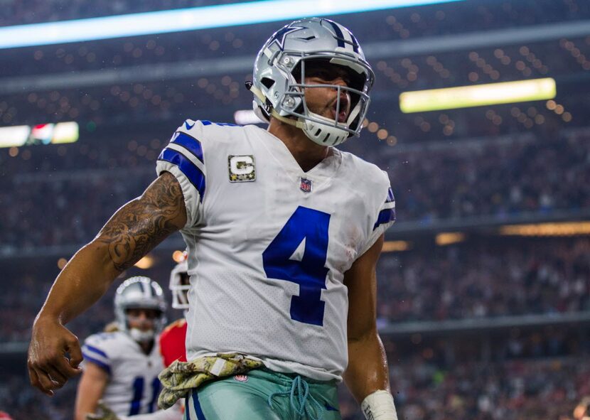 Dallas Cowboys quarterback Dak Prescott (4) runs to the end zone for a touchdown during the...