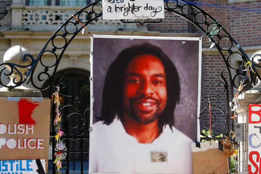FILE - In this July 25, 2016, file photo, a memorial including a photo of Philando Castile...