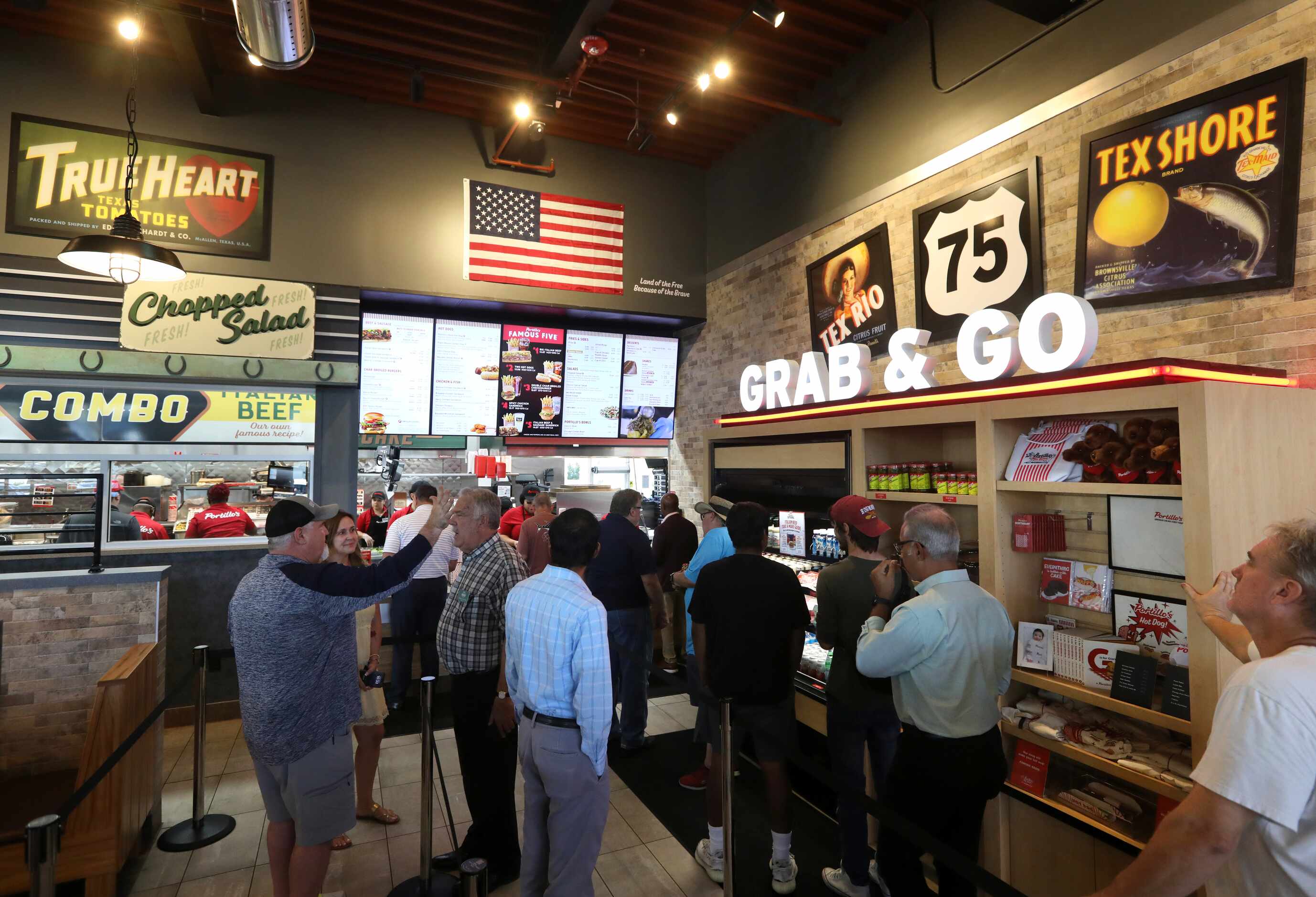 Guests wait in line to order at Portillo's in Allen.